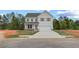 Charming two-story home with a two-car garage and a well-manicured lawn at 576 Teversham Dr, Mcdonough, GA 30253