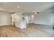 Open kitchen design with a center island, stainless steel appliances, and modern pendant lighting at 576 Teversham Dr, Mcdonough, GA 30253