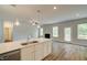 Well-designed kitchen with stainless steel appliances, a large island, and modern pendant lights at 576 Teversham Dr, Mcdonough, GA 30253