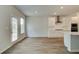 Bright kitchen features white cabinets, stainless appliances, and access to a backyard deck at 576 Teversham Dr, Mcdonough, GA 30253
