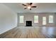 Spacious living room with a fireplace and plenty of natural light at 576 Teversham Dr, Mcdonough, GA 30253