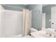 Bathroom features neutral colors, a shower with a beige shower curtain at 6236 Benbrooke Nw Dr, Acworth, GA 30101