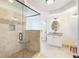 Modern bathroom featuring a tiled walk-in shower with a glass door and a granite-topped vanity at 6236 Benbrooke Nw Dr, Acworth, GA 30101