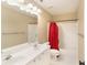 Well-lit bathroom features a double sink vanity, and a shower with a red curtain at 6236 Benbrooke Nw Dr, Acworth, GA 30101