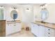Bright bathroom featuring dual vanities with granite countertops and oval mirrors at 6236 Benbrooke Nw Dr, Acworth, GA 30101