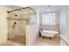 Elegant bathroom with a walk-in shower, a claw foot tub, and wainscoted walls at 6236 Benbrooke Nw Dr, Acworth, GA 30101