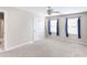 Bright bedroom with three windows providing ample light and neutral-toned carpeting at 6236 Benbrooke Nw Dr, Acworth, GA 30101