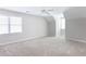 Spacious bedroom with neutral carpeting and multiple windows for natural light at 6236 Benbrooke Nw Dr, Acworth, GA 30101