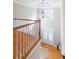 Bright entryway features hardwood floors, elegant chandelier, and transom window over the front door at 6236 Benbrooke Nw Dr, Acworth, GA 30101