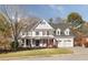 Traditional two-story home with a manicured front lawn and a three-car garage, perfect for a Gathering at 6236 Benbrooke Nw Dr, Acworth, GA 30101