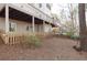Backyard exterior with stairs and multiple doors, offering convenient access and outdoor enjoyment at 6236 Benbrooke Nw Dr, Acworth, GA 30101