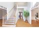 Grand foyer with hardwood floors, a staircase, and an open layout exudes spaciousness and elegance at 6236 Benbrooke Nw Dr, Acworth, GA 30101