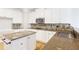 The gourmet kitchen is equipped with stainless appliances, custom cabinets, beautiful backsplash, and a functional center island at 6236 Benbrooke Nw Dr, Acworth, GA 30101