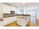 Bright kitchen with granite countertops, stainless appliances, gas range, white cabinets, and an eat-in breakfast nook at 6236 Benbrooke Nw Dr, Acworth, GA 30101