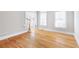 Bright living room featuring hardwood floors and large windows, offering ample natural light and a welcoming atmosphere at 6236 Benbrooke Nw Dr, Acworth, GA 30101