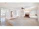 Open-concept living room featuring a fireplace with built-in shelving, and hardwood floors creating a welcoming space at 6236 Benbrooke Nw Dr, Acworth, GA 30101