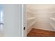Walk-in pantry with an organized system of shelving, providing ample storage space for dry goods and other kitchen essentials at 6236 Benbrooke Nw Dr, Acworth, GA 30101