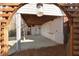 Covered stone patio with decorative arbor, creating a charming outdoor space at 6236 Benbrooke Nw Dr, Acworth, GA 30101