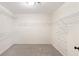 Walk-in closet with carpet and built-in shelving for ample storage at 6236 Benbrooke Nw Dr, Acworth, GA 30101