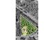 An aerial perspective showcasing the property boundaries and lot lines of the home surrounded by lush trees at 105 Chantilly Ln, Fayetteville, GA 30215