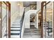Elegant foyer with staircase and hardwood floors at 105 Chantilly Ln, Fayetteville, GA 30215