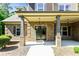 Welcoming brick front with double doors, lush landscaping, and traditional design at 105 Chantilly Ln, Fayetteville, GA 30215