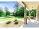 Charming front porch with brick columns and lush landscaping at 105 Chantilly Ln, Fayetteville, GA 30215