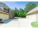 Three-car garage with ample parking space and manicured landscaping at 105 Chantilly Ln, Fayetteville, GA 30215