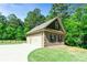 Detached two-car garage with brick accents and ample parking space at 105 Chantilly Ln, Fayetteville, GA 30215