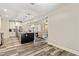 Open-concept kitchen with white cabinetry, stainless steel appliances, and island with bar seating at 105 Chantilly Ln, Fayetteville, GA 30215