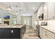 Modern kitchen with white cabinets, granite countertops, stainless steel appliances, and an island with a sink at 105 Chantilly Ln, Fayetteville, GA 30215