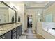 Main bathroom features double vanity, soaking tub, glass shower, and a walk-in closet at 105 Chantilly Ln, Fayetteville, GA 30215