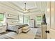 Main bedroom features decorative ceilings, ceiling fan, and large windows with natural light at 105 Chantilly Ln, Fayetteville, GA 30215