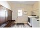 Mudroom offers a wooden bench with hooks, washer and dryer, and a door leading outside at 105 Chantilly Ln, Fayetteville, GA 30215