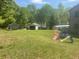 Spacious, grassy backyard with storage sheds, perfect for enjoying outdoor activities at 1500 Country Ct, Auburn, GA 30011