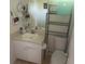 Small bathroom with a pedestal sink and tile floors at 1500 Country Ct, Auburn, GA 30011