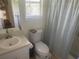 Bathroom featuring a sink, toilet, and tub with shower at 1500 Country Ct, Auburn, GA 30011