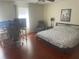 Cozy bedroom with hardwood floors and large windows at 1500 Country Ct, Auburn, GA 30011