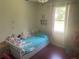 Bright bedroom with natural light, and hardwood floors at 1500 Country Ct, Auburn, GA 30011