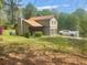 Quaint two-story home with a two-car garage and well-maintained front yard at 1500 Country Ct, Auburn, GA 30011