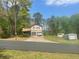 Charming two-story home with a two-car garage and extra storage building at 1500 Country Ct, Auburn, GA 30011