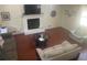 Comfortable living room with a fireplace, hardwood floors, and neutral paint at 1500 Country Ct, Auburn, GA 30011