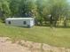 Durable shed with roll-up door, perfect for extra storage on the property at 1500 Country Ct, Auburn, GA 30011