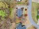 An aerial shot showcases a home with a gray roof, surrounded by manicured landscaping and mature trees at 162 Brookhaven Way, Rockmart, GA 30153