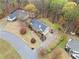 Overhead view of a well-maintained home with a lush landscape and a long driveway on a peaceful street at 162 Brookhaven Way, Rockmart, GA 30153