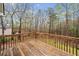 Elevated back deck providing lovely views of lush greenery and wooded property at 162 Brookhaven Way, Rockmart, GA 30153