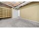 Unfinished basement featuring carpeted floors, shelving for storage and exposed ceiling with utilities at 162 Brookhaven Way, Rockmart, GA 30153