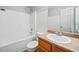 Bathroom featuring tub and shower combination, toilet, and vanity with sink and wood cabinetry at 162 Brookhaven Way, Rockmart, GA 30153