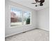 Bedroom with plush carpeting, a window with natural light, and neutral decor for a serene atmosphere at 162 Brookhaven Way, Rockmart, GA 30153