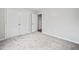 Bedroom with plush carpeting, neutral decor, a closet and doorway with views into other rooms at 162 Brookhaven Way, Rockmart, GA 30153